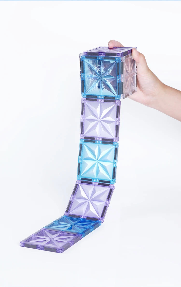 Magnetic Tiles Starshine – 100 piezas en tonos cristal, azul y morado con carrito y muñeco incluidos